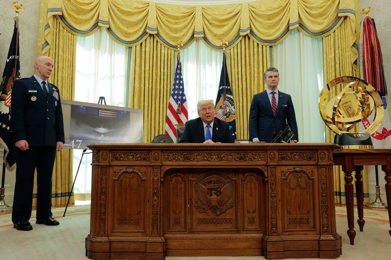 President Donald Trump speaks alongside U.S. Gen. David Allvin, Chief of Staff of the Air Force (L) and U.S. Secretary of Defense Pete Hegseth (R) in the Oval Office of the White House on March 21, 2025 in Washington, DC.