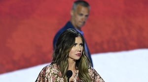 Kristi Noem takes part in a sound check as political commentator Corey Lewandowski looks on at the Fiserv Forum ahead of the 2024 Republican National Convention on July 14, 2024 in Milwaukee, Wisconsin.