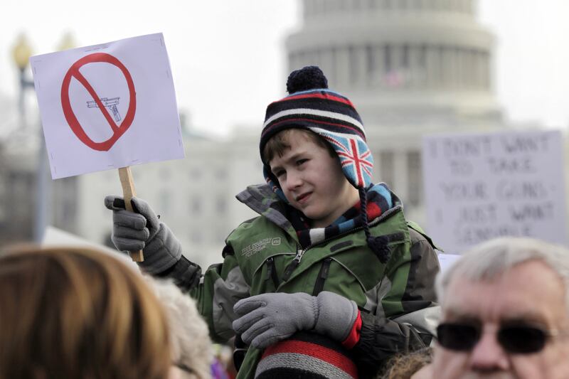 articles/2013/01/29/as-more-kids-die-handguns-still-a-bigger-threat-than-assault-rifles/130128-kid-carnage-daly-tease_sphxjs