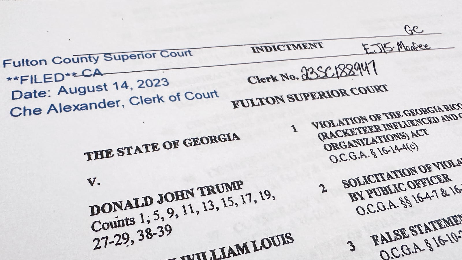 The first page of a 98-page grand jury indictment charging Donald Trump and 18 orhers.