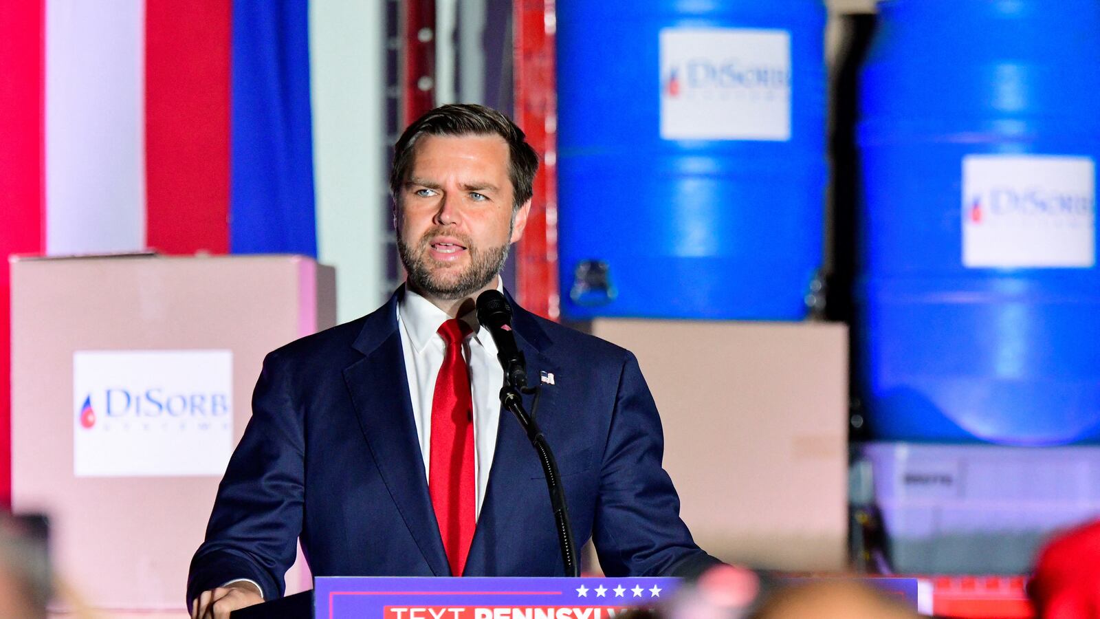 JD Vance in front of an American flag