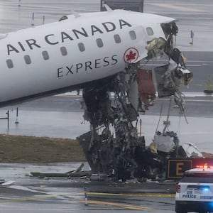 An Air Canada Express CRJ-900 sits on the runway after colliding with a Port Authority fire truck at LaGuardia Airport in New York, on March 23, 2026.