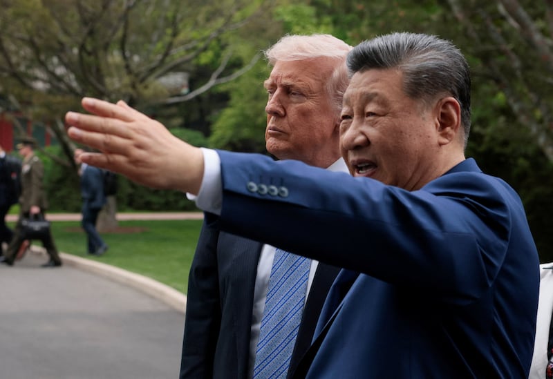 Chinese President Xi Jinping gestures as he greets U.S. President Donald Trump at Zhongnanhai Garden in Beijing, China, May 15, 2026.