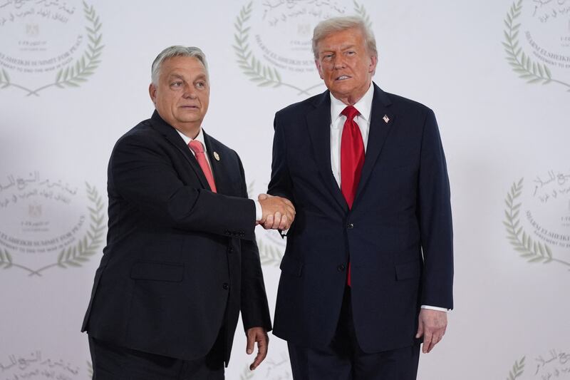 President Donald Trump greets Hungary's Prime Minister Viktor Orban during a summit on Gaza in Sharm el-Sheikh on October 13, 2025.