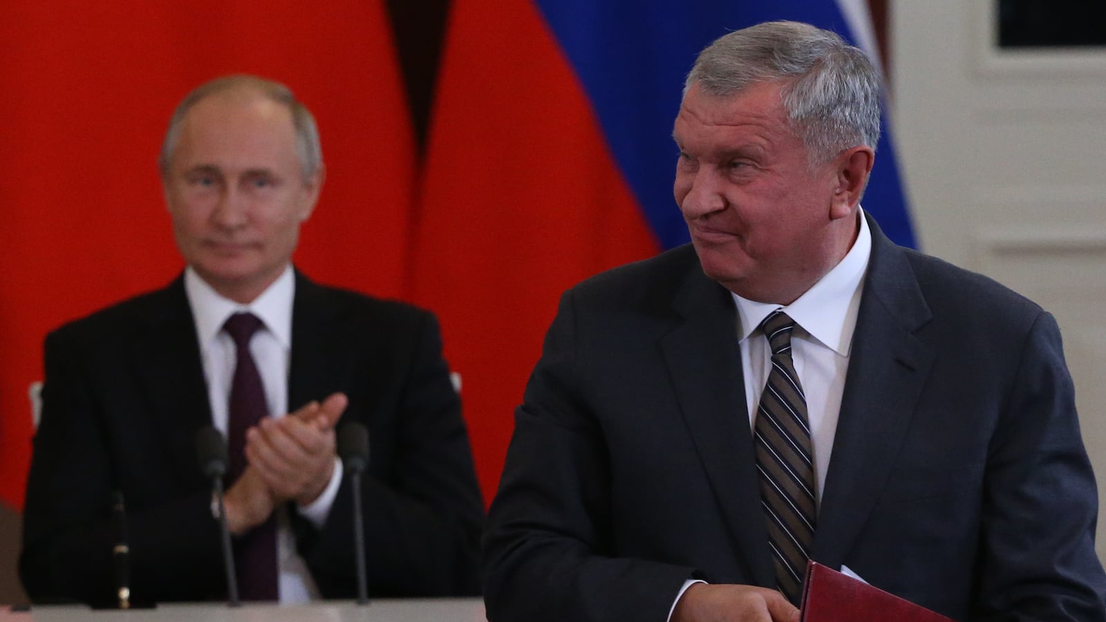 Russian President Vladimir Putin (L) looks at Rosneft President Igor Sechin (R) during Russian-Chinese talks at the Grand Kremlin Palace in Moscow, Russia.