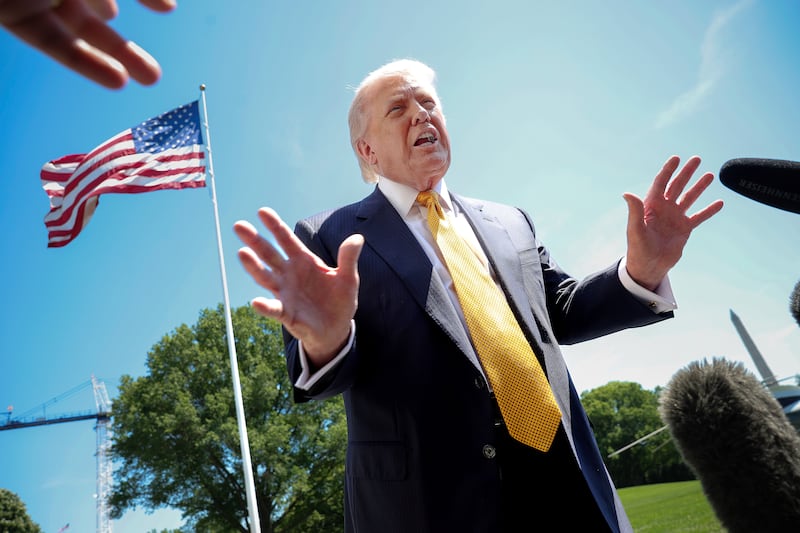 President Donald Trump speaks as he departs the White House.