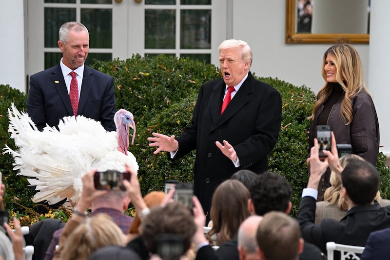 First Lady Melania Trump looks on as US President Donald Trump pardons Gobble, one of the National Thanksgiving turkeys, during the White House turkey pardon ceremony in the Rose Garden of the White House in Washington, DC on November 25, 2025. (Photo by Alex WROBLEWSKI / AFP via Getty Images)
