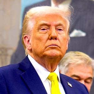 U.S. President Donald Trump, accompanied by Health and Human Services Secretary Robert F. Kennedy Jr. (L), takes a question