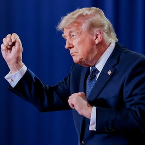 U.S. President Donald Trump reacts on the stage on the day of delivering remarks at Rockland Community College in Suffern, New York, U.S., May 22, 2026.