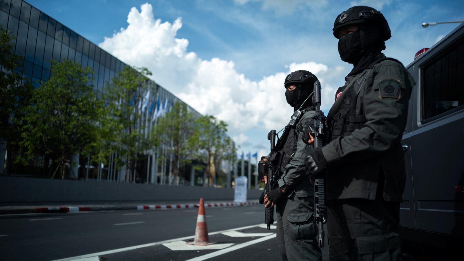 Riot police officers stand guard in front of the Queen Sirikit National Convention Center where the APEC summit will be held, in Bangkok, Thailand, Nov. 15, 2022.