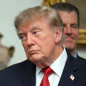 President Donald Trump speaks with the Chairman of the US Securities and Exchange Commission (SEC) Paul Atkins during a meeting with cryptocurrency executives in the Roosevelt Room of the White House in Washington, DC, on August 19, 2026.