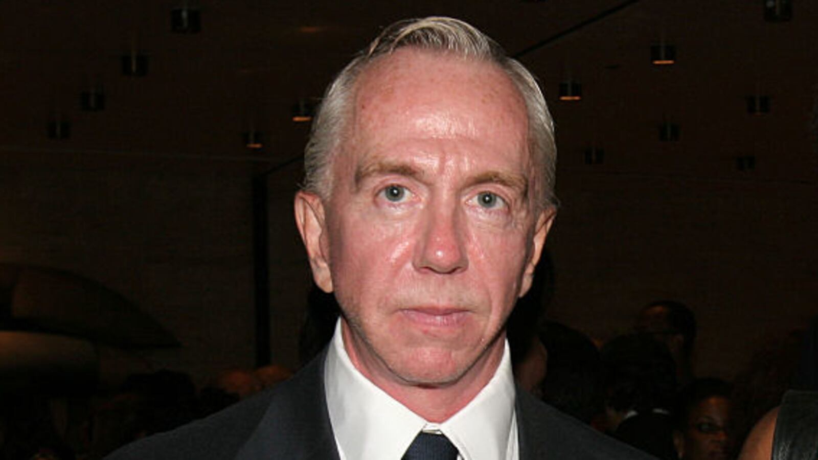 Brent Sikkema stares forward while posing for a photo at an event.