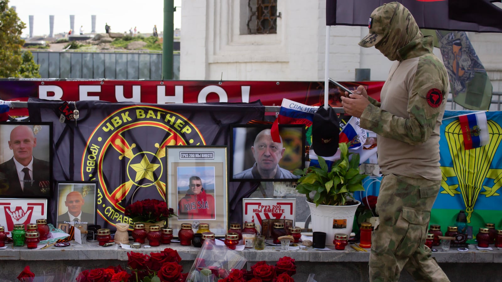 An alleged member of the Wagner private military group stands guard at the informal memorial for the Wagner leader Yevgeny Prigozhin near Red Square in Moscow.