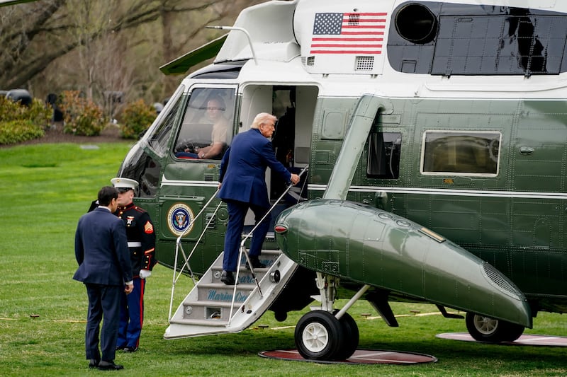 U.S. President Donald Trump boards Marine One as he departs the White House for Florida, in Washington, D.C., U.S., March 20, 2026. REUTERS/Nathan Howard