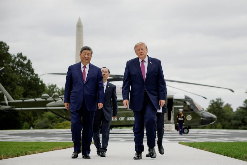 US President Donald Trump and Chinese President Xi Jinping walk back to the White House in Washington, D.C., US, September 24, 2026. REUTERS/Evan Vucci     TPX IMAGES OF THE DAY