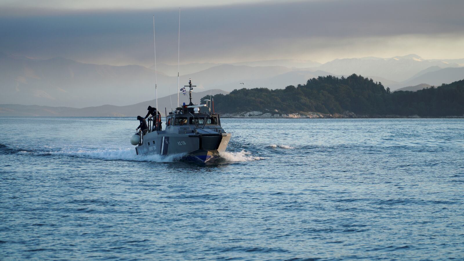 A Greek coast guard vessel approaches the port on Corfu, Greece, Feb. 18, 2022.