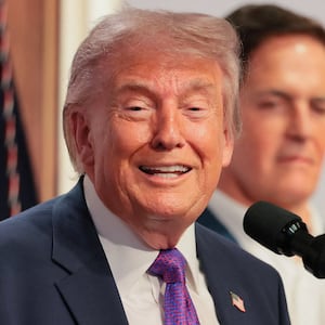 Centre for Medicare & Medicaid Services Administrator Dr Mehmet Oz, Heidi Overton and Mark Cuban react as U.S. President Donald Trump delivers remarks about health care costs and affordability from an auditorium on the White House campus in Washington, D.C., U.S., May 18, 2026.