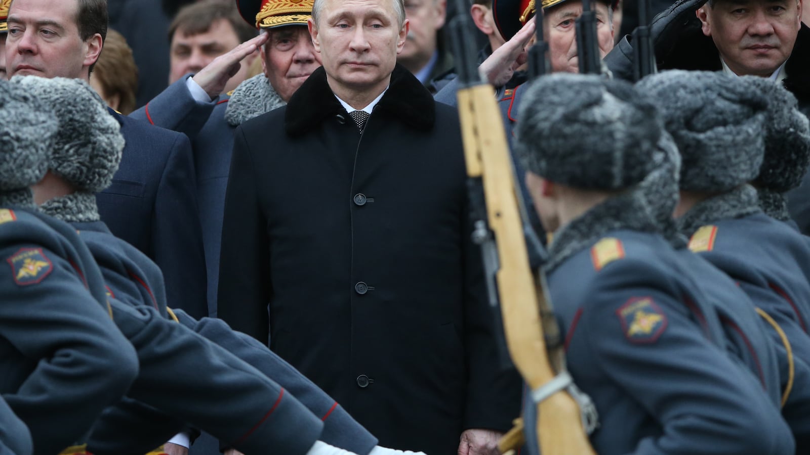 MOSCOW, RUSSIA - FEBRUARY 23: Russian President Vladimir Putin (C), Prime Minister Dmitry Medvedev (L) and Defence Minister Sergei Shoigu (R) attend a wreath laying ceremony at the tomb of the unknown soldier to mark the Defender of the Fatheland Day on February 23, 2015 in central Moscow, Russia. Originally known as 'Red Army Day' and later observed as 'Soviet Army and Navy Day', it was decreed a state holiday in 2002 after being renamed 'Defender of the Motherland Day'. The holiday marks the foundation of Red Army in 1918 and focuses on achievements of military forces and veterans. (Photo by Sasha Mordovets/Getty Images)