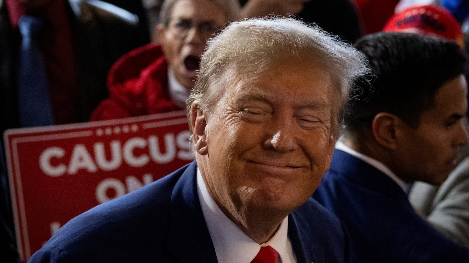 Former U.S. President and Republican presidential candidate Donald Trump rallies with supporters at a “commit to caucus” event at a whiskey bar in Ankeny, Iowa.