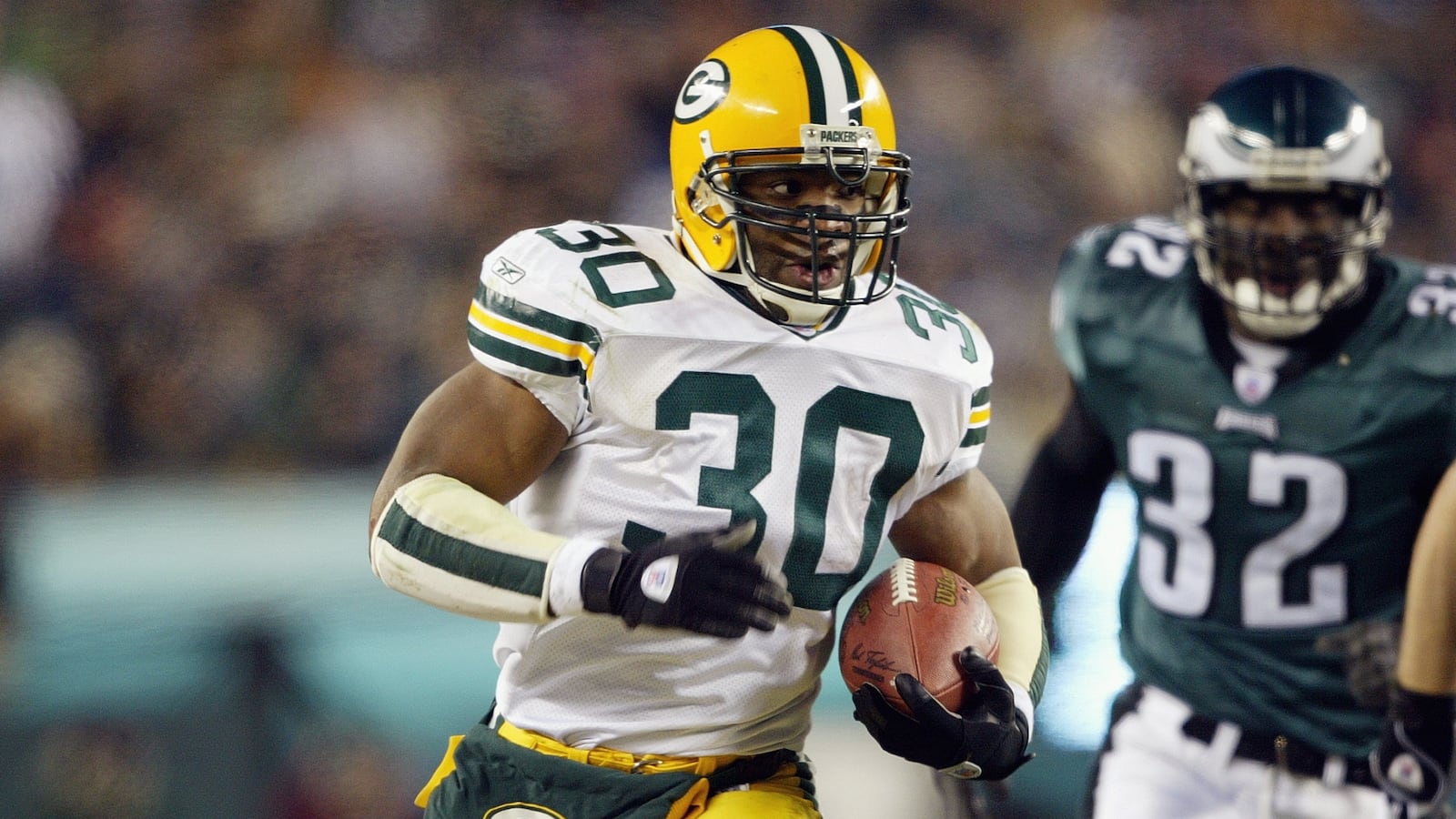 Running back Ahman Green #30 of the Green Bay Packers runs the football during the game against the Philadelphia Eagles in the NFC divisional playoffs on January 11, 2004 at Lincoln Financial Field in Philadelphia, Pennsylvania.