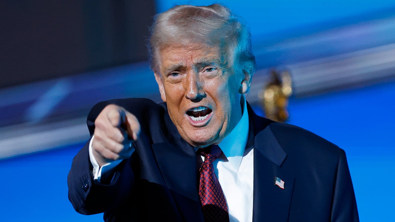 MIAMI, FLORIDA - NOVEMBER 05: U.S. President Donald Trump gestures after delivering remarks during the America Business Forum at the Kaseya Center on November 05, 2025 in Miami, Florida. The forum brings together global leaders, cultural figures and innovators from various sectors for discussions on business, technology and social development. (Photo by Kevin Dietsch/Getty Images)