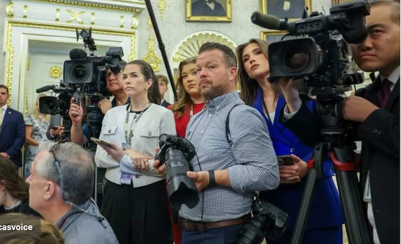 Beni Rae Harmony (head tilted, next to camera lens) in the Oval Office.