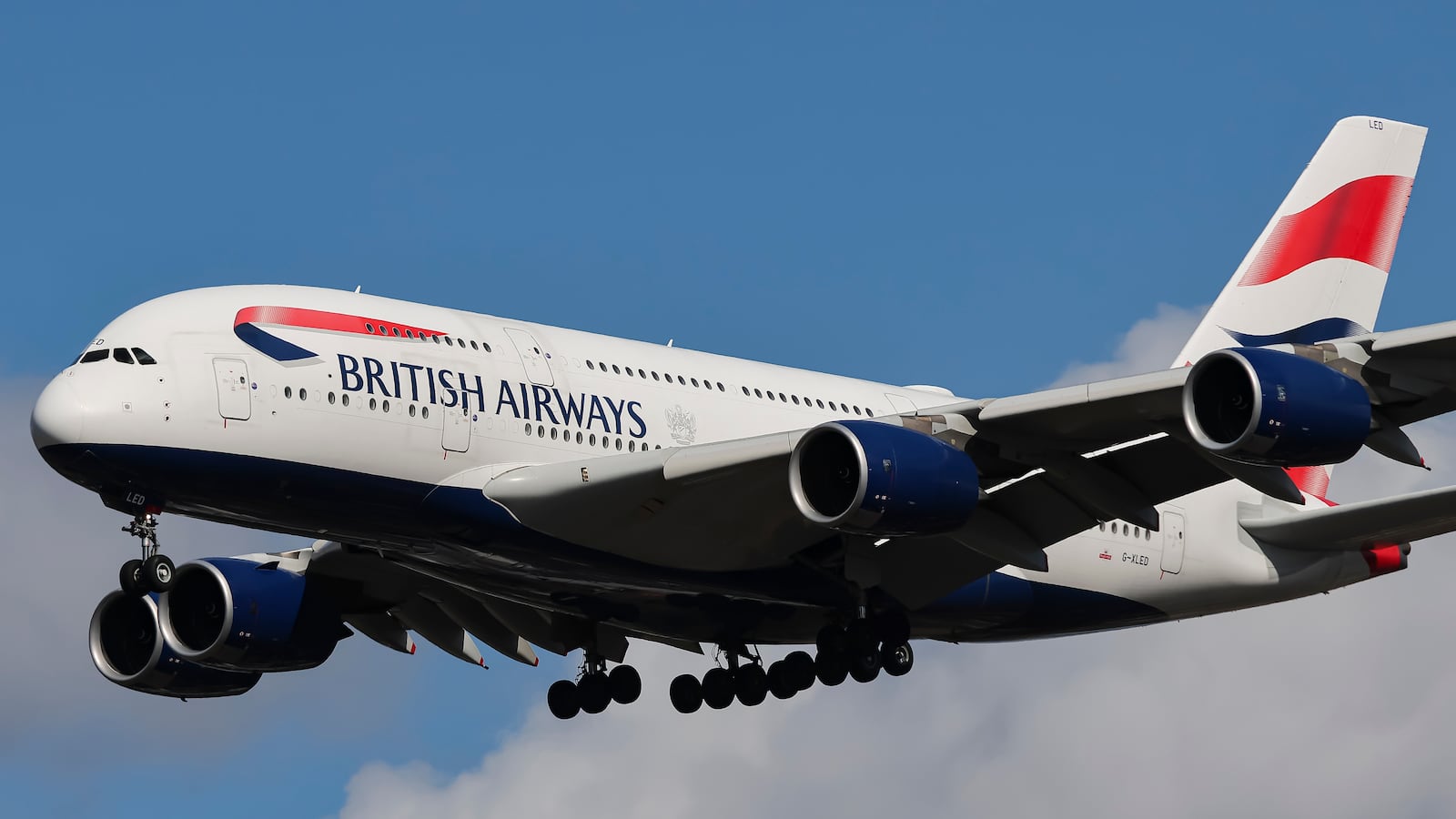 British Airways Airbus A380 Superjumbo passenger aircraft, spotted flying on final approach for landing on London Heathrow Airport runway in the United Kingdom. The double decker wide body airliner is the world's largest jet. The BA A380 airplane has the registration tail number G-XLED and is powered by 4x RR Trent 970 engines. The pictured airplane is arriving from Johannesburg JNB International Airport in South Africa as Flight BA56. British Airways is the flag carrier airline of the United Kingdom with main hub at Heathrow Airport, operating a fleet of 244 planes and member of Oneworld aviation alliance group. Since 2011 BA merged with Iberia creating the International Airlines Group IAG, the third largest airline group in the world. September 11, 2024 (Photo by Nicolas Economou/NurPhoto via Getty Images)