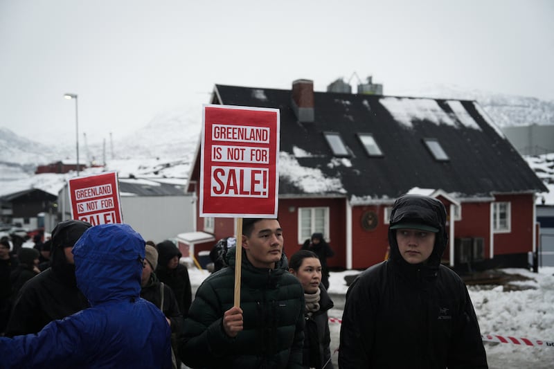 Young people with placards reading "Greenland is not for sale!" take part in a demonstration against U.S. President Donald Trump's purported plans to take over the territory on January 17, 2026 in Nuuk.