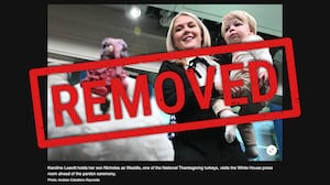 A screen grab from Tages-Anzeiger of the photo of Karoline Leavitt with her son Nicholas, and Waddle, one of the National Thanksgiving turkeys, in the press briefing room of the White House, prior to the turkey pardoning ceremony with President Donald Trump on Nov. 25, 2025, in Washington, DC., before being pulled by the AFP.