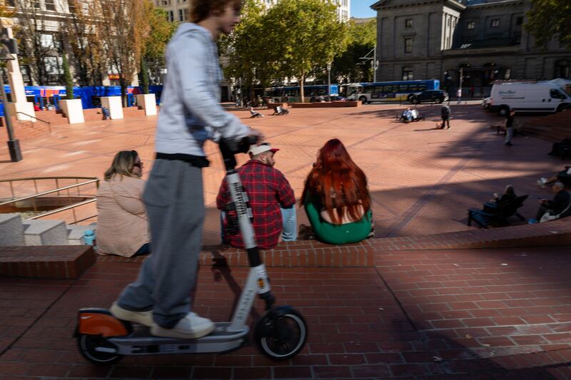 PORTLAND, OREGON - OCTOBER 06: People gather at a public square in the downtown section on October 06, 2025 in Portland, Oregon. National Guard troops from California, Texas and Oregon are in limbo in the state after a federal judge temporarily halted deployment by the Trump administration after being sued by local leaders, ruling that the ongoing demonstrations in the state did not amount to a "rebellion." The administration has appealed the ruling.