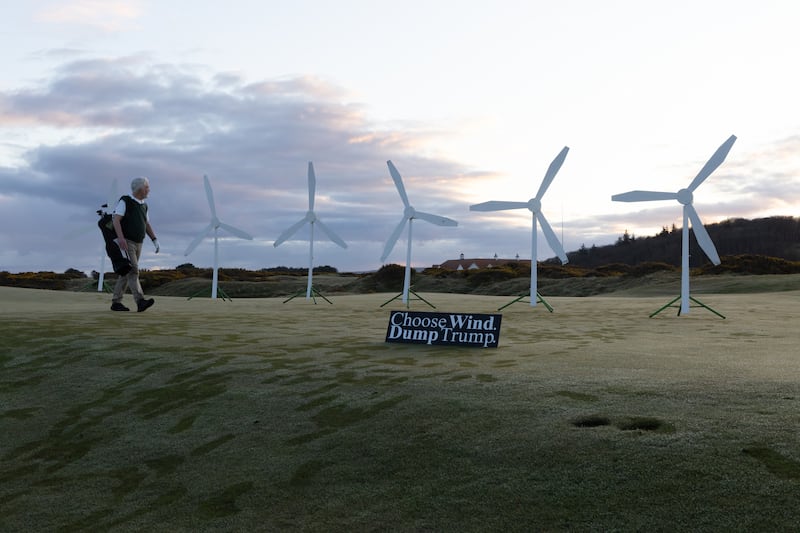 Greenpeace activists install a wind farm on a green of the Trump Turnberry Golf Club,   together with a sign reading ‘Choose wind, dump Trump’.  Polling shows that roughly two-thirds of Scottish voters (65%) believe Britain should not follow US President Donald Trump’s calls for increasing oil and gas extraction and should instead focus on boosting renewable energy.