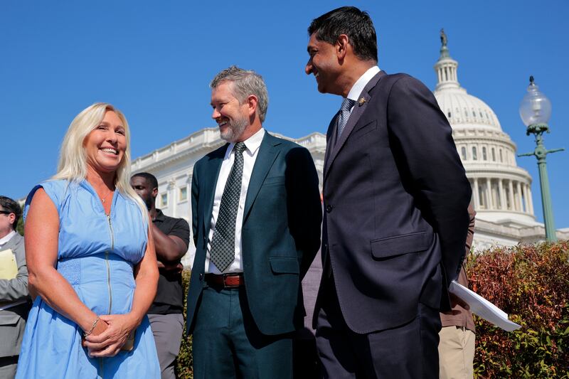 Rep. Marjorie Taylor Greene (R-SC) speaks with Rep. Thomas Massie (R-KY) and Rep. Ro Khanna (D-CA) during a news conference with alleged victims of disgraced financier and sex trafficker Jeffrey Epstein outside the U.S. Capitol on September 03, 2025 in Washington, DC.