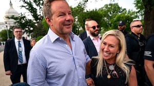 WASHINGTON, DC - MAY 8: Rep. Marjorie Taylor Greene (R-GA), and her boyfriend Brian Glenn a host at the conservative Right Side Broadcasting Network, walk together after she and Rep. Thomas Massie (R-KY) spoke to members of the press on the steps of the House of Representatives at the U.S. Capitol on May 8, 2024 in Washington, DC. The House voted overwhelmingly to save Speaker Johnson from Marjorie Taylor Greene's push to oust him from his leadership position, voting 359 to 43 to table the motion to vacate. (Photo by Kent Nishimura/Getty Images)
