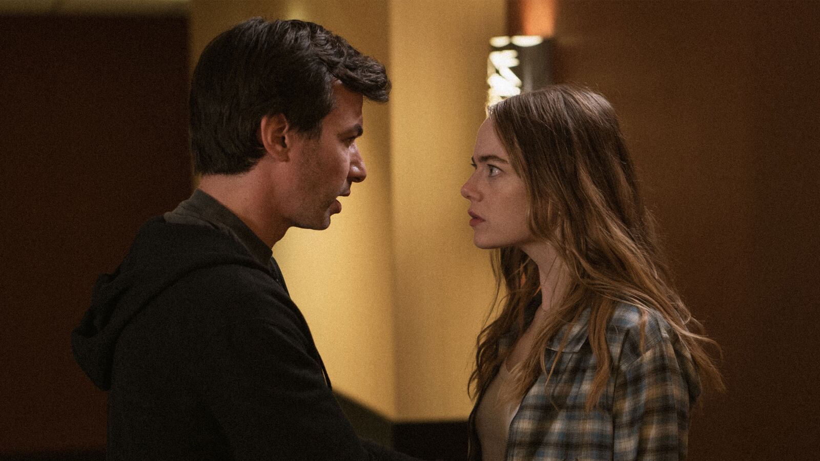 Nathan Fielder with his hands on Emma Stone's arms in a still from 'The Curse'