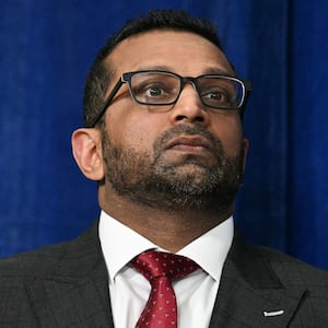 FBI Director Kash Patel looks on as President Donald Trump speaks to the press following U.S. military actions in Venezuela, at his Mar-a-Lago residence in Palm Beach, Florida, on January 3, 2026.