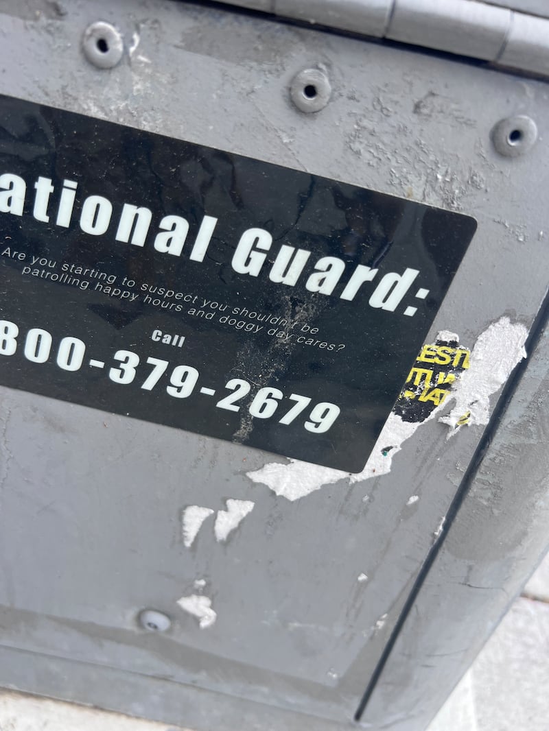 sticker on utility pole in Washington D.C. reach out to bored National Guards.