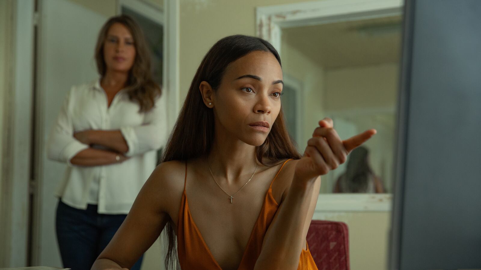 Karla Sofía Gascón as Emilia Pérez and Zoe Saldaña as Rita Moro Castro