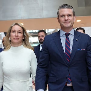 Pete Hegseth, U.S. President-elect Donald Trump's nominee for Secretary of Defense, and his wife Jennifer Rauchet arrive for a meeting at the Hart Senate Office Building.