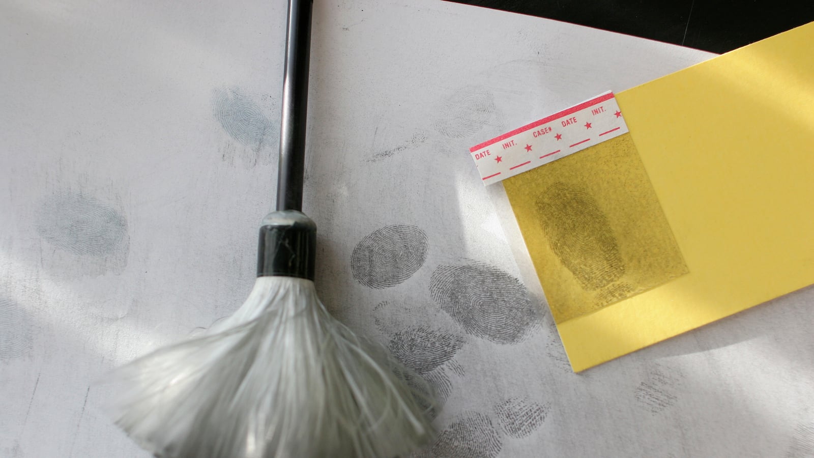 A brush used for fingerprint examination is displayed next to a fingerprint sample in a state government crime lab in the border city of Ciudad Juarez March 3, 2009.