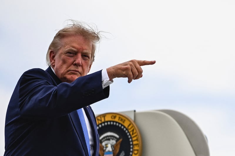 U.S. President Donald Trump points a finger as he boards Air Force One at Morristown Municipal Airport in Morristown, New Jersey, U.S., August 2, 2026.