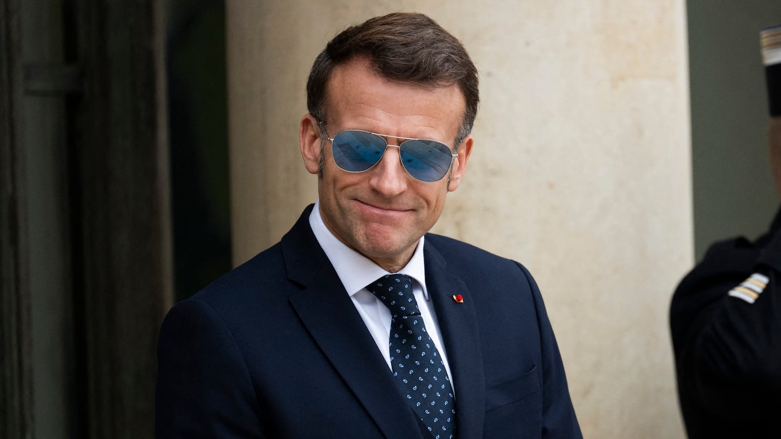 France s President Emmanuel Macron wearing a sunglasses waits to welcome Prime Ministers of Greenland and Denmark at the Elysee Palace in Paris, on January 28, 2026. (Photo by Magali Cohen / Hans Lucas / AFP via Getty Images)