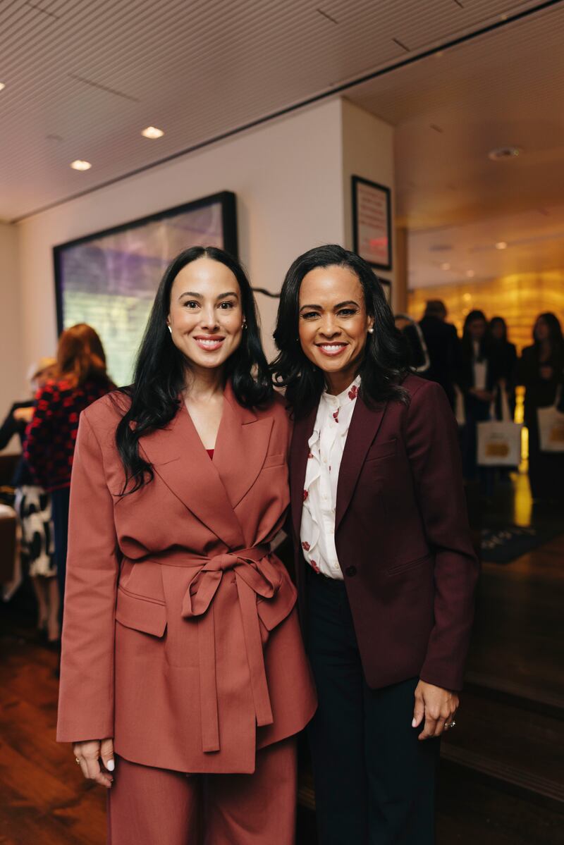 Meena Harris and Linsey Davis pose for a photo at the Power 100 luncheon.