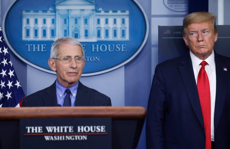 U.S. President Donald Trump looks at National Institute of Allergy and Infectious Diseases Director Dr. Anthony Fauci as Fauci answers a question during the daily coronavirus task force briefing at the White House in Washington, U.S., April 17, 2020.