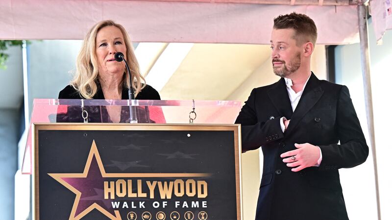 Macaulay Culkin looks on as Canadian-US actress Catherine O'Hara speaks.