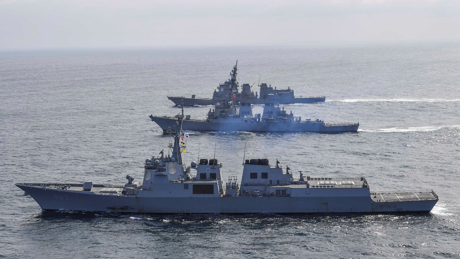 South Korean Navy's destroyer Yulgok Yi I, the US Navy's destroyer USS Benfold and Japan Maritime Self-Defense Force's destroyer Atago take part in joint naval missile defense exercises.
