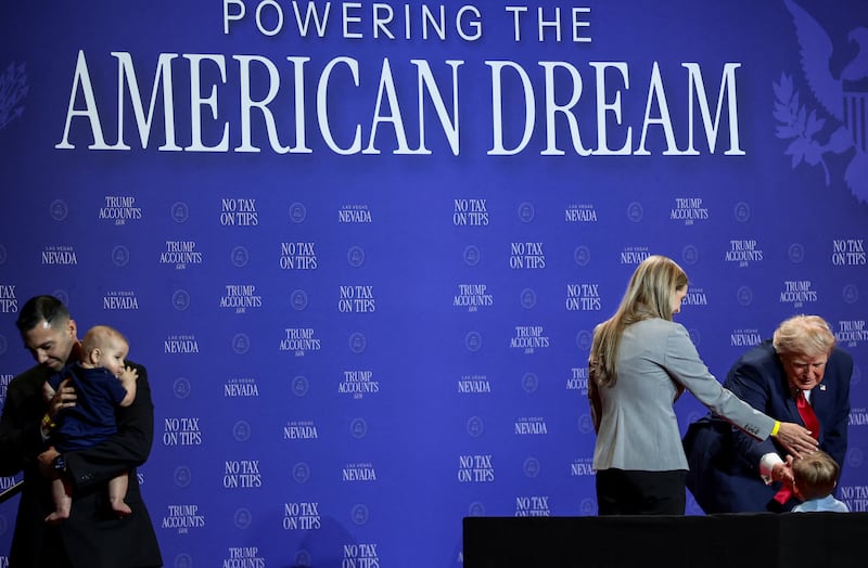 U.S. President Donald Trump shakes hands with a boy after inviting the child's family on stage, stopping him from running off the stage and making a joke about former U.S. President Joe Biden during remarks at Red Rock Casino Resort Spa in Las Vegas, Nevada, U.S., August 5, 2026. REUTERS/Evelyn Hockstein