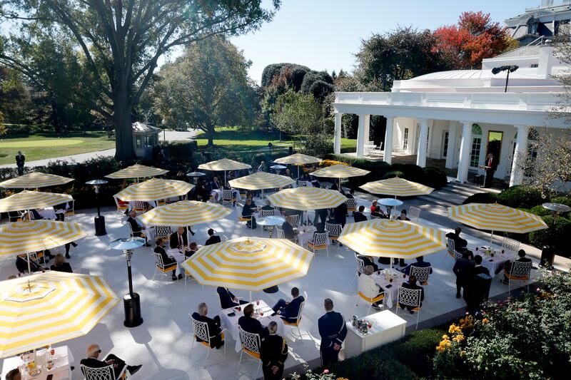 The Rose Garden this week—the yellow-and-white striped umbrellas are similar to those found at the poolside of Trump’s Florida resort.