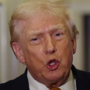 IN FLIGHT - JANUARY 04:  President Donald Trump speaks to the media aboard Air Force One en route to Washington, DC on January 04, 2026. Trump is returning to the White House after giving the order for the United States law enforcement to capture Venezuelan President Nicolás Maduro and his wife. (Photo by Joe Raedle/Getty Images)