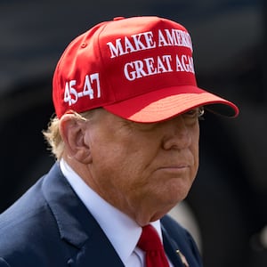Former U.S. President Donald Trump speaks to the media as he arrives at the Atlanta Airport on April 10, 2024 in Atlanta, Georgia.