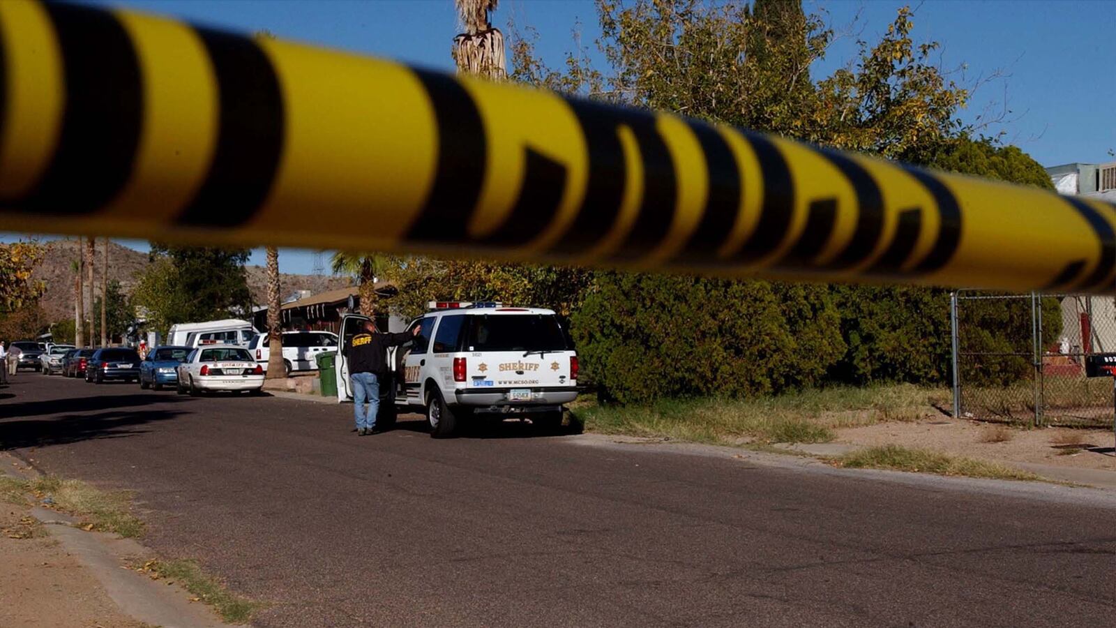 Crime tape is photographed at a crime scene at an East Mesa home Dec. 10, 2002, in Phoenix, Arizona.